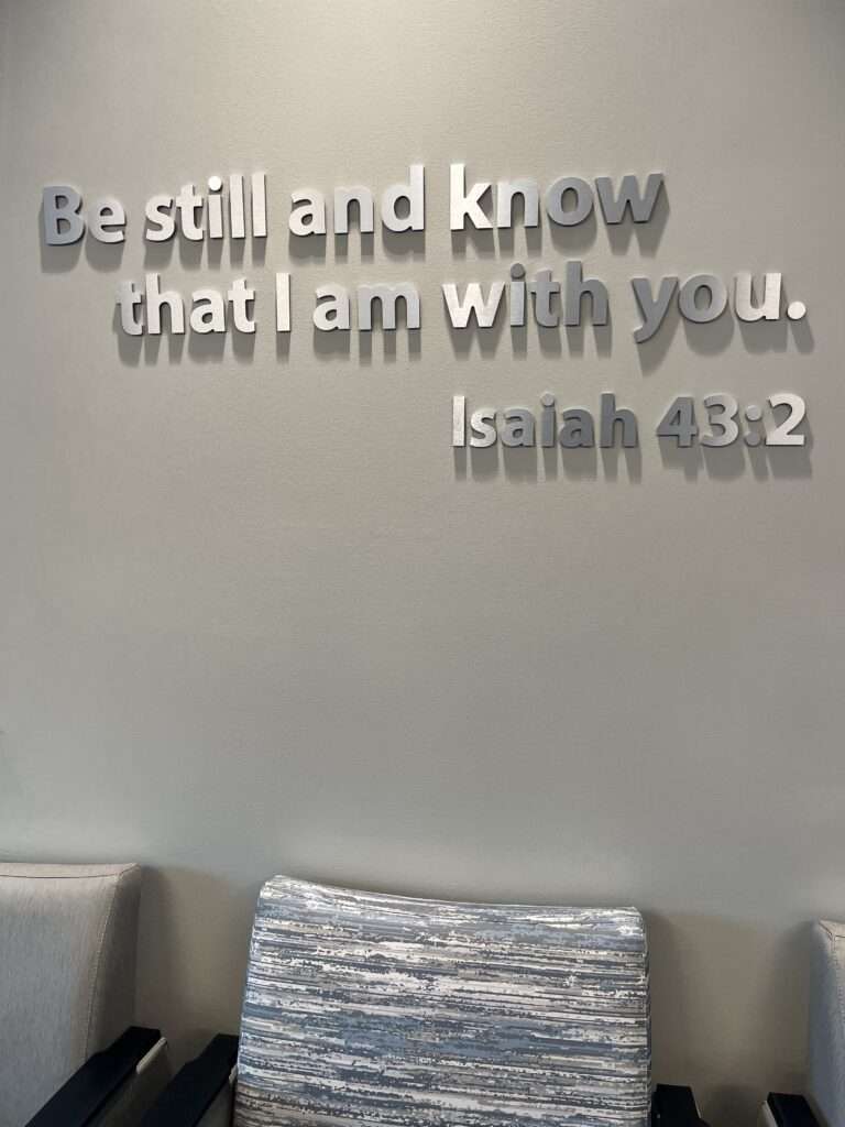 Wall art in a hospital that reads: "Be still and know that I am with you" Isaiah 43:2