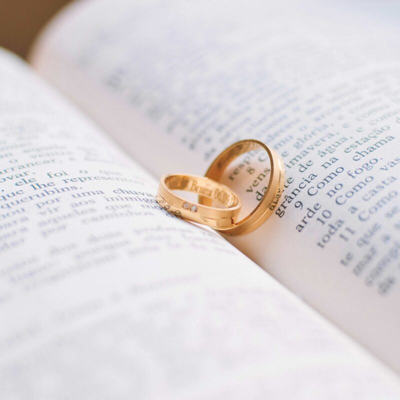 Photo by Caio  : https://www.pexels.com/photo/two-gold-colored-wedding-bands-on-book-page-56926/